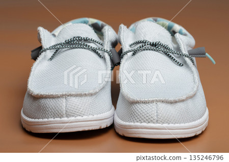 Front view of pair cloth shoes 135246796