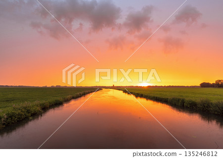 Orange sunset over Dwingelder Stroom river Orange sunset over Dwingelder Stroom river 135246812
