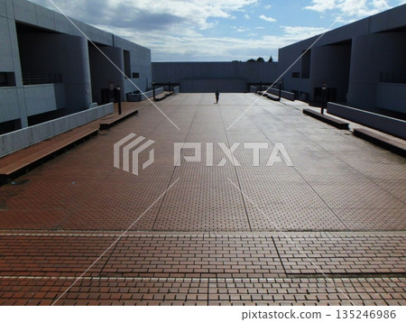 An open outdoor deck space connecting the buildings An open outdoor deck space connecting the buildings 135246986