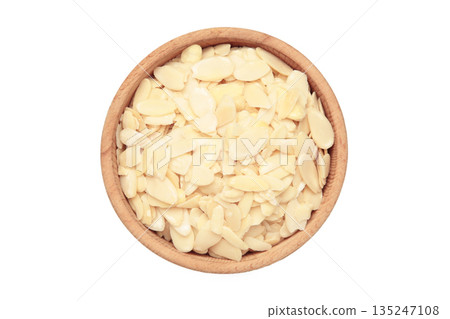 Fresh almond flakes in bowl isolated on white background. Fresh almond flakes in bowl isolated on white background. 135247108