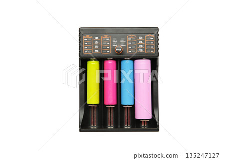 Rechargeable batteries in a battery charger. Four batteries in a charger. NI-MH and LI-MH battery. 135247127