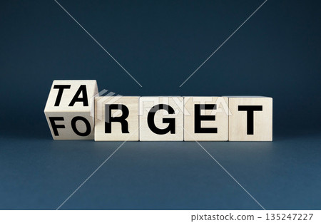 Wooden blocks spelling out Target and Forget Wooden blocks spelling out Target and Forget 135247227