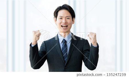 Male businessman doing guts pose 135247239