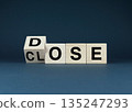 Wooden blocks spelling DOSE and CLOSE. 135247293