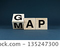Wooden blocks spelling GAP and MAP 135247300