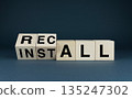Wooden blocks with the words INSTALL and RECALL 135247302