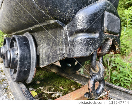 train part details, detailed view of train bogie undercarriage revealing corrosion and mechanical train part details, detailed view of train bogie undercarriage revealing corrosion and mechanical 135247744