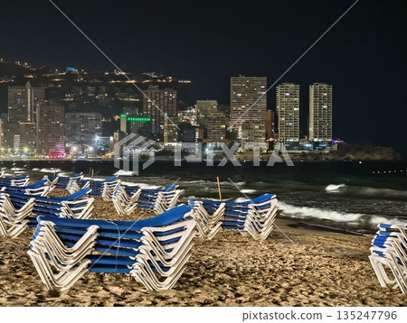 beachfront chairs with cityscape in background, seaside lounge chairs gazing over vibrant city beachfront chairs with cityscape in background, seaside lounge chairs gazing over vibrant city 135247796