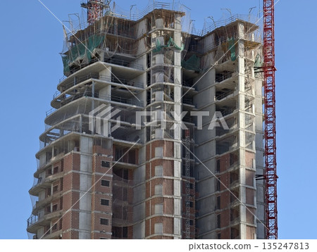construction site of tall concrete building with engineering inspection and safety measures construction site of tall concrete building with engineering inspection and safety measures 135247813