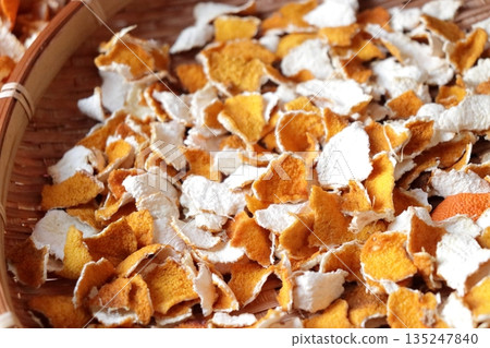Photo of drying mandarin peels. Photo of drying mandarin peels. 135247840
