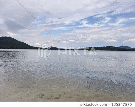 peaceful boat scene, quiet boat drifting by towering mountain peaks over mirrorlike water reflecting peaceful boat scene, quiet boat drifting by towering mountain peaks over mirrorlike water reflecting 135247870
