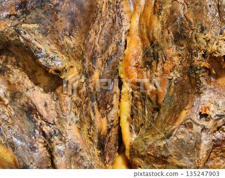 luxurious gemstone detailed, richly colored agate with organic marbling and shimmering golden 135247903