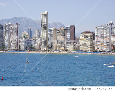 Contemporary residential buildings overlooking turquoise sea Contemporary residential buildings overlooking turquoise sea 135247937