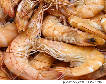 Professional kitchen dish featuring delicate shrimp with lemon Professional kitchen dish featuring delicate shrimp with lemon 135247960