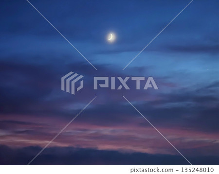 Moonlit violet panorama, Night sky with glowing celestial body 135248010