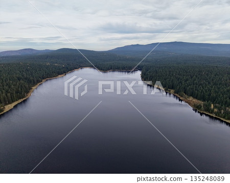 drone captures shoreline and water features, mapping tranquil lake for environmental analysis drone captures shoreline and water features, mapping tranquil lake for environmental analysis 135248089