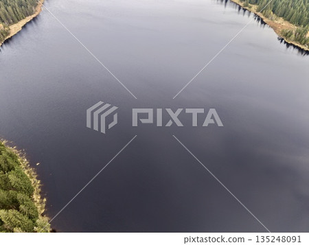 quiet lakeside with lush trees, peaceful water scene with winding coast and reflective surface quiet lakeside with lush trees, peaceful water scene with winding coast and reflective surface 135248091
