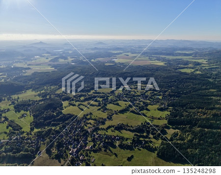 Highaltitude Rural Landscape, Aerial Perspective Showcasing Patchwork Fields And Rural Hamlets Highaltitude Rural Landscape, Aerial Perspective Showcasing Patchwork Fields And Rural Hamlets 135248298
