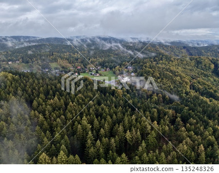 Colorful Hilltop Aerial View, Autumn Ridge Aerial Shot Showcasing Lush Hills And Misty Woods Colorful Hilltop Aerial View, Autumn Ridge Aerial Shot Showcasing Lush Hills And Misty Woods 135248326