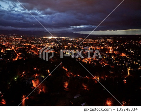Urban Nightscape Imagery, Nighttime Urban Panorama Showcasing Glowing Streets And Distant Skyscrapers Urban Nightscape Imagery, Nighttime Urban Panorama Showcasing Glowing Streets And Distant Skyscrapers 135248334