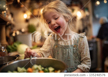 Happy child cooking delicious vegetable stew in a rustic kitchen, enjoying healthy food preparation 135248576