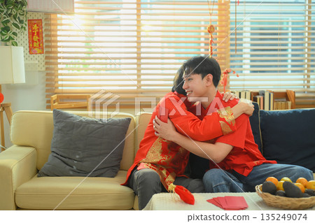 Elderly father hugs his adult son with warmth and gratitude during a heartfelt Chinese New Year family reunion Elderly father hugs his adult son with warmth and gratitude during a heartfelt Chinese New Year family reunion 135249074