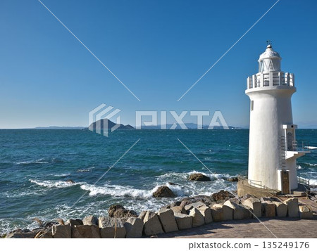 Irago Cape Lighthouse and the blue waters of Mikawa Bay: A white lighthouse standing on the clear Pacific Ocean Irago Cape Lighthouse and the blue waters of Mikawa Bay: A white lighthouse standing on the clear Pacific Ocean 135249176