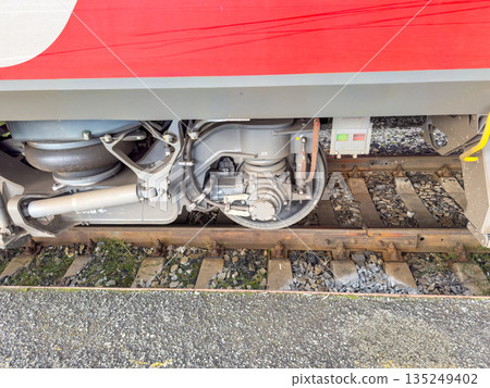 Train wheel assembly with mechanical components on railway tracks 135249402