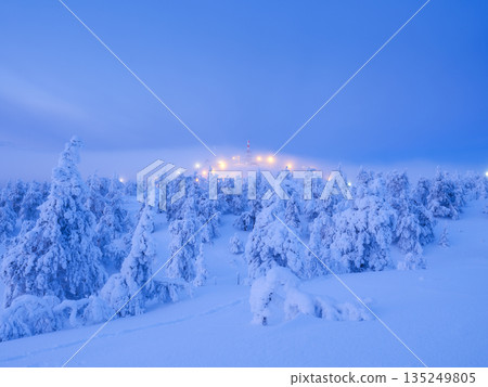 Serene cold atmosphere, majestic peaks, crystal reflections. Winter mountain landscape at blue hour. 135249805