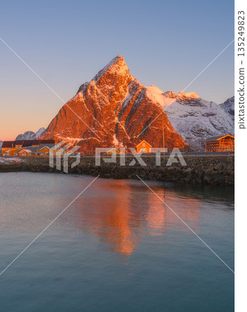 Vertical view of Reine and Hamnoy fishing villages at sunrise, Norway 135249823