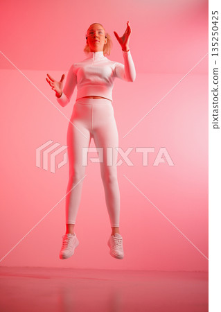 Woman in smartglasses gesturing in mid-air Woman in smartglasses gesturing in mid-air 135250425