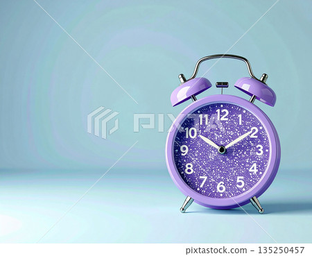 Alarm clock in retro style. Purple vintage alarm clock on background in pastel color with copy space. Bright design. Alarm clock in retro style. Purple vintage alarm clock on background in pastel color with copy space. Bright design. 135250457