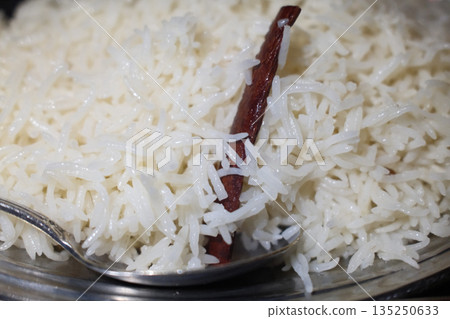 Traditional Indian meals with colorful spices, rice, curry and flatbread served on decorated table. 135250633