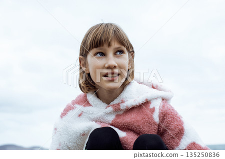 little cute blond girl curious smiling playing outside on sea, lifestyle people concept little cute blond girl curious smiling playing outside on sea, lifestyle people concept 135250836