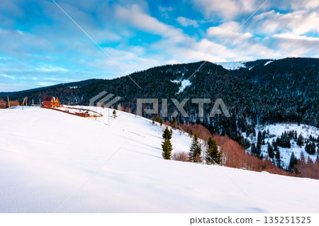 beautiful winter landscape with snow covered hills on sunny morning. serene rural scene in carpathian mountains. rolling countryside area in ukraine. christmas backdrop for holiday or vacation concept beautiful winter landscape with snow covered hills on sunny morning. serene rural scene in carpathian mountains. rolling countryside area in ukraine. christmas backdrop for holiday or vacation concept 135251525