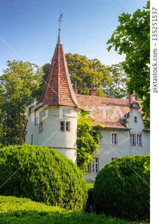 chynadiievo, transcarpathia, ukraine - 28 jul, 2013: schonborn royal palace under blue sky. heritage site in carpathians. popular tourist destination. hunting castle now a sanatorium on sunny day 135251537