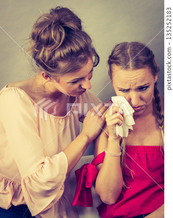 Friend comforting sad woman 135252183