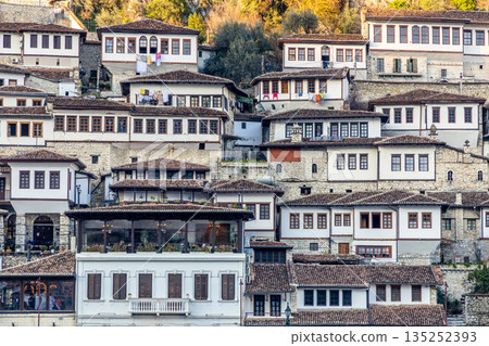 Albanian town historic center with traditional Ottoman houses on a hillside with white stone architecture, Berat, Albania Albanian town historic center with traditional Ottoman houses on a hillside with white stone architecture, Berat, Albania 135252393