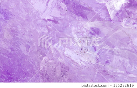 amethyst crystal displays frozen textures with cool Purple hues. The icy surface of the gemstone 135252619