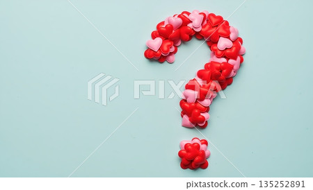 Question mark made of red and pink hearts on a blue background. Love and relationship uncertainty concept for Valentine's Day. Flat lay with copy space for text Question mark made of red and pink hearts on a blue background. Love and relationship uncertainty concept for Valentine's Day. Flat lay with copy space for text 135252891
