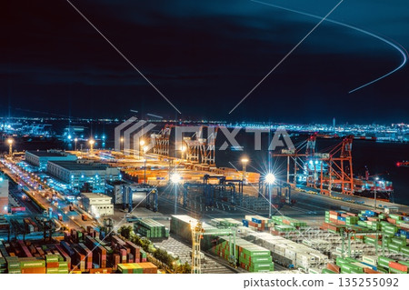 Night view of the Aomi Container Terminal from the Telecom Center in Odaiba and the light trails of planes taking off and landing at Haneda Airport 135255092