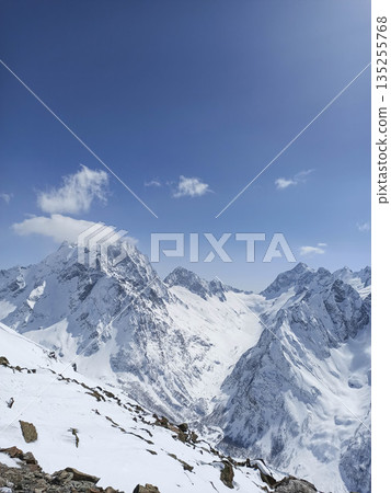 Snow-covered mountain peaks Snow-covered mountain peaks 135255768