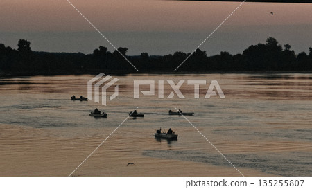 Boats on a wide river 135255807