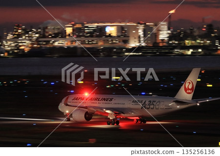 Haneda Airport at night: Passenger plane heading for a night flight Haneda Airport at night: Passenger plane heading for a night flight 135256136