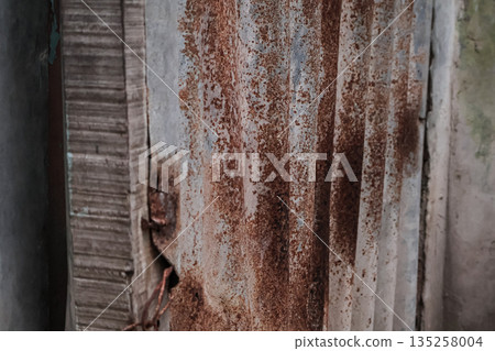 Textured rusty metal surface featuring detailed corrosion and weathered elements, ideal for industrial background and design concepts Textured rusty metal surface featuring detailed corrosion and weathered elements, ideal for industrial background and design concepts 135258004