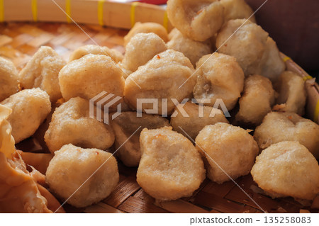 Delicious Indonesian Cireng Snack Piled on Woven Tray, Illuminated by Natural Light, Perfect for Street Food Promotion Delicious Indonesian Cireng Snack Piled on Woven Tray, Illuminated by Natural Light, Perfect for Street Food Promotion 135258083