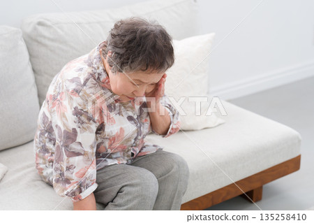 A woman in her 80s with a headache 135258410