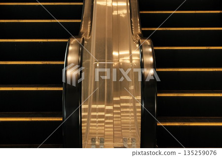 Reflecting light on an escalator Reflecting light on an escalator 135259076