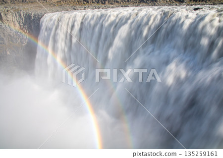Dettifoss and a rainbow flowing down the Jokulsarlon River in the northern part of the Nordic island nation of Iceland 135259161