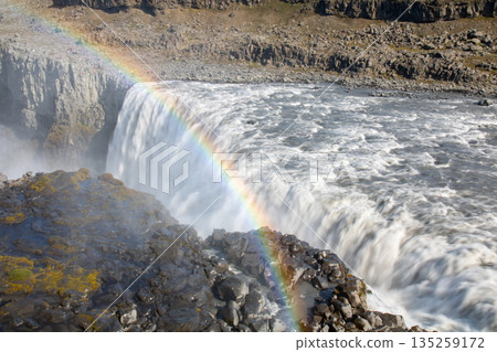 Dettifoss and a rainbow flowing down the Jokulsarlon River in the northern part of the Nordic island nation of Iceland Dettifoss and a rainbow flowing down the Jokulsarlon River in the northern part of the Nordic island nation of Iceland 135259172